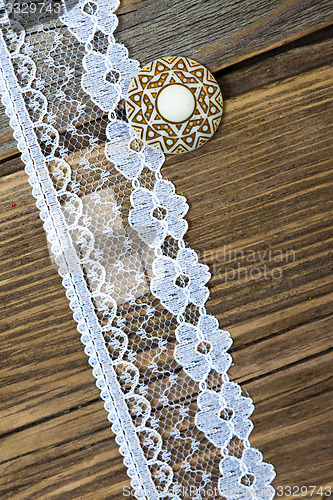 Image of vintage button and lace tape