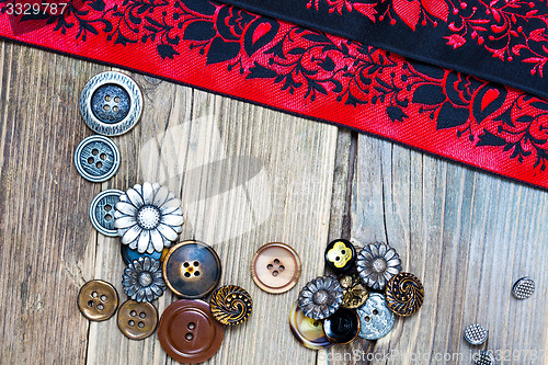 Image of vintage tape, lace, ribbons and old buttons