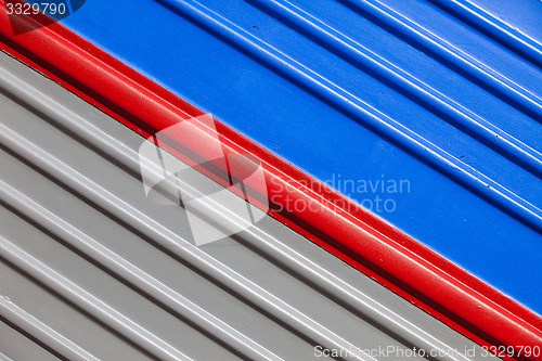 Image of gray-blue background with a diagonal red stripe