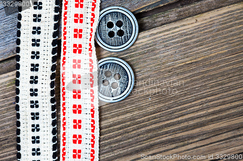 Image of vintage bands with embroidered ornaments and old buttons