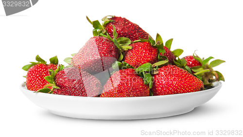 Image of In front pile of fresh juicy strawberries on white plate