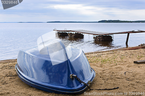 Image of Boat on wild lake beach