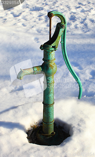 Image of Water pump in the garden at winter 