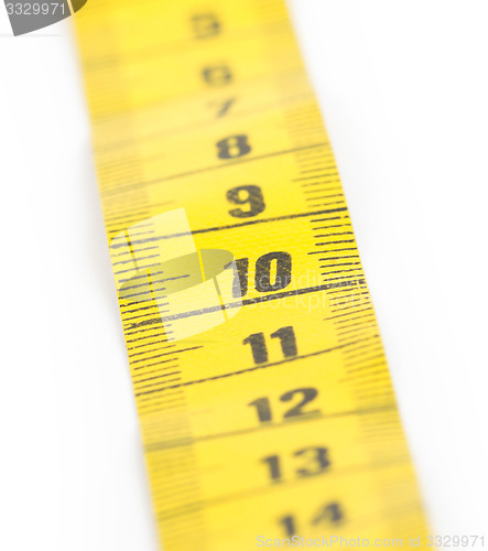 Image of Yellow measuring tape isolated - selective focus