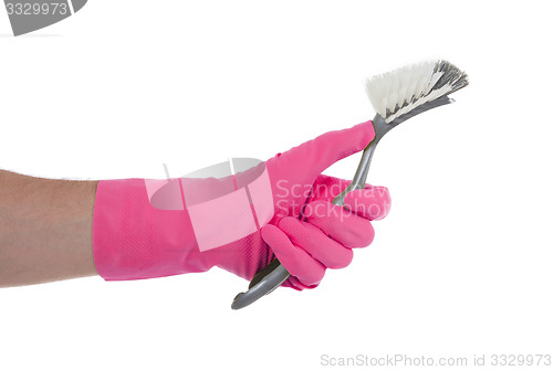 Image of Protection glove holding a dish-brush