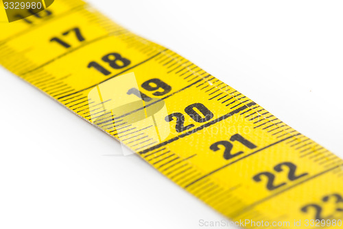 Image of Yellow measuring tape isolated - selective focus