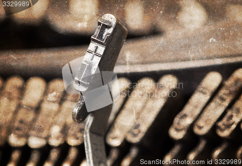 Image of L hammer - old manual typewriter - warm filter