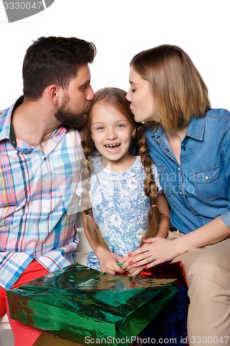 Image of Happy family with shopping bags sitting at studio 