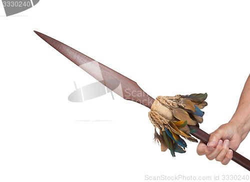 Image of Old hand hodling an old wooden spear