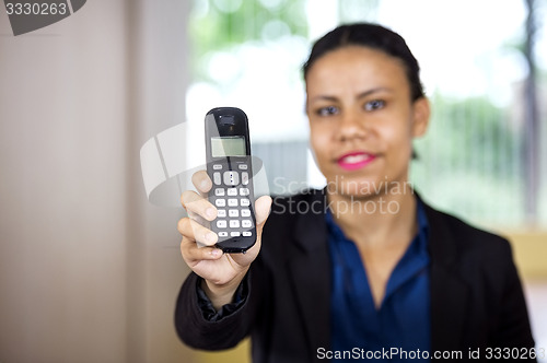 Image of Receptionist Holding Cordless Phone