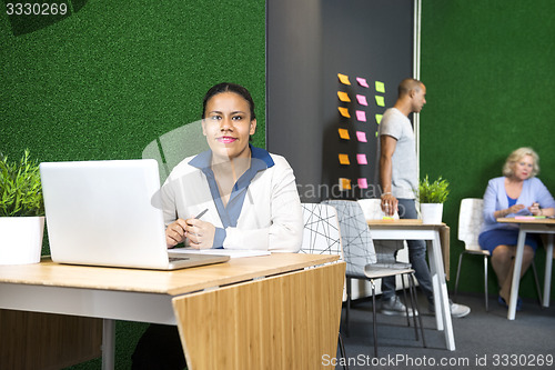 Image of Confident Businesswoman At Office Lobby