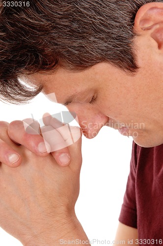 Image of Close up of praying young man.