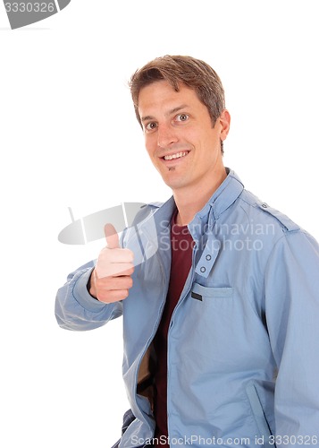 Image of Happy young man with his thump up.