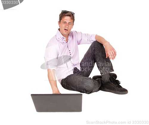 Image of Man surprised on the computer screen.