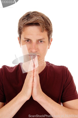 Image of Handsome man with folded hands.