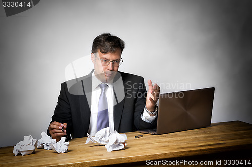 Image of Overworked businessman