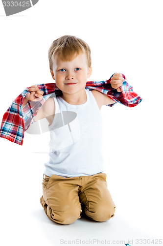 Image of little boy in a plaid shirt over a white