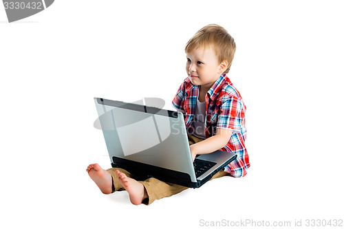 Image of boy in a plaid shirt with a laptop on a white background.
