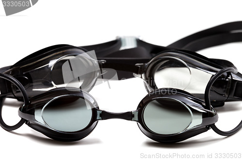 Image of Two black goggles for swimming on white background