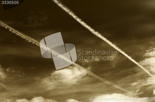 Image of Sepia sky with contrails