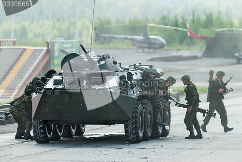 Image of BTR-82A armoured personnel carrier with soldiers