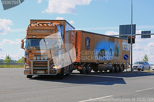 Image of Scania Trailer Truck with James Bond Theme in Traffic