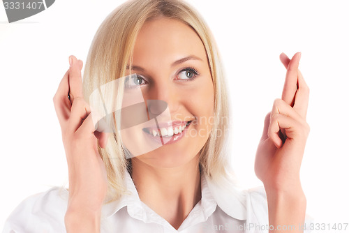 Image of Pretty girl with crossed fingers