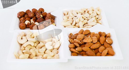 Image of nuts mix in square paper plates