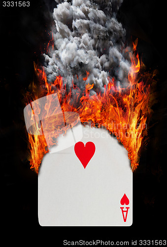 Image of Playing card with fire and smoke