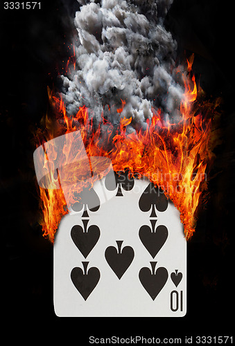 Image of Playing card with fire and smoke