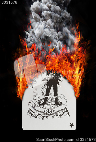 Image of Playing card with fire and smoke