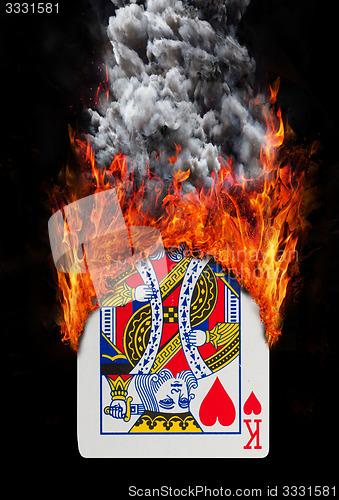 Image of Playing card with fire and smoke