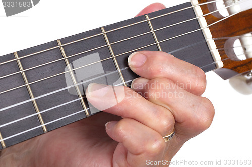 Image of Old hand and guitar isolated