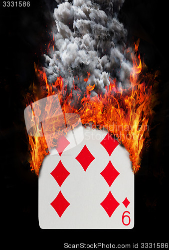 Image of Playing card with fire and smoke