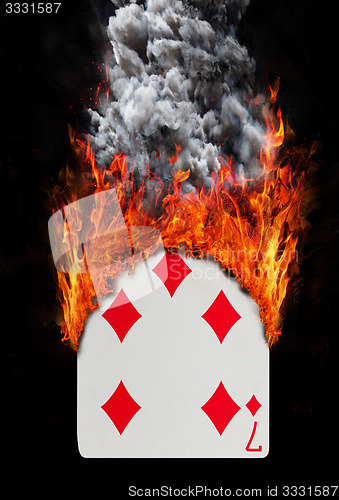 Image of Playing card with fire and smoke