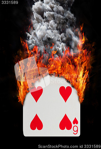 Image of Playing card with fire and smoke