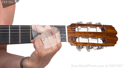 Image of Old hand and guitar isolated