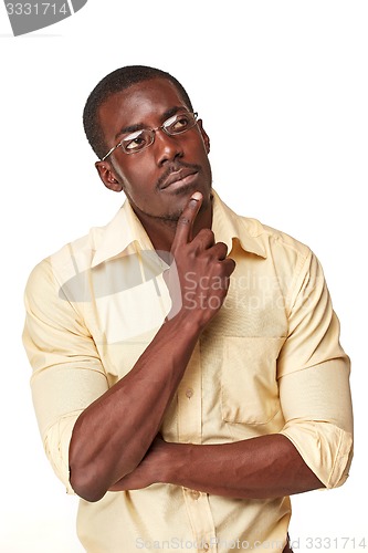 Image of Young  black african man thinking and reminiscing about something