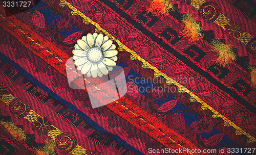 Image of vintage tape with embroidered ornaments and old buttons