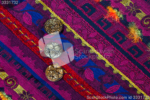 Image of vintage tape with embroidered ornaments and old buttons