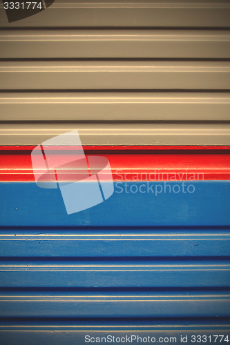 Image of blue-gray background with a red stripe