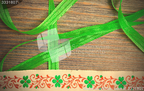 Image of embroidered band and green tape