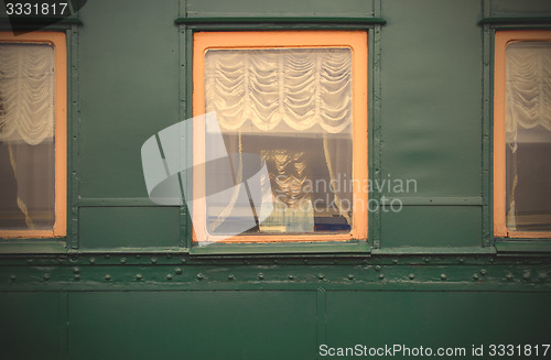 Image of windows of vintage railroad wagon-lit