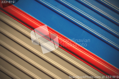 Image of gray-blue background with a diagonal red stripe