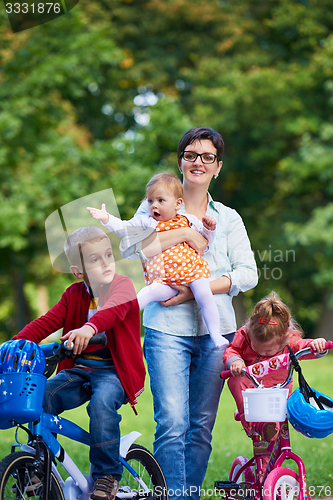 Image of modern mother portrait  with kids in park