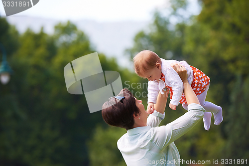 Image of mother and baby in park