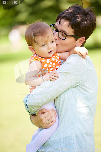 Image of mother and baby in park