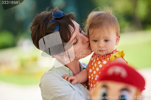 Image of mother and baby in park