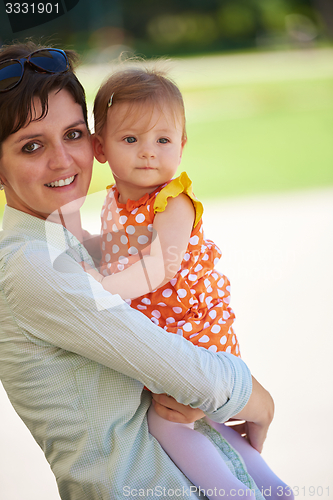 Image of mother and baby in park