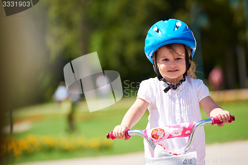 Image of little girl with bicycle